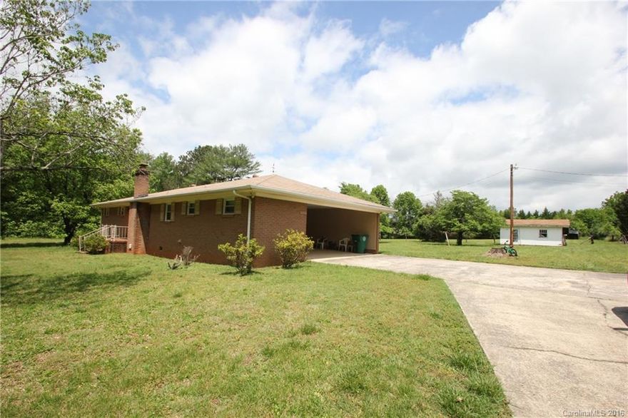 3.25 Acres of Cleared Partially Fenced Property with a nice sized ranch style Home.  3 Bedrooms 1.5 Baths with hardwood Floors and a open living area!  Beautiful Pond is on the property!  Bring your Horse or Cows!  Attached 2 Car Carport!