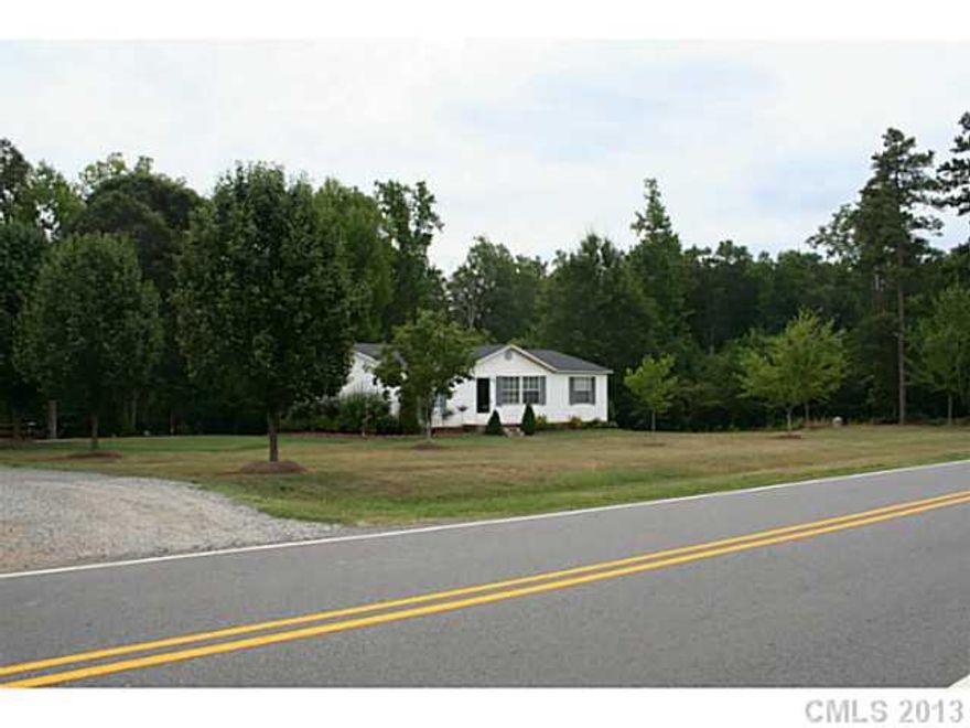 Fast going area. Ideal for small business. Conveniently located to I77, Lake Norman, Schools, and the Village at Byers Creek. The home is currently rented month to month ($800.00 / month) and the tenants may be willing to stay. Income producing property with commercial potential. 258 feet of road frontage.