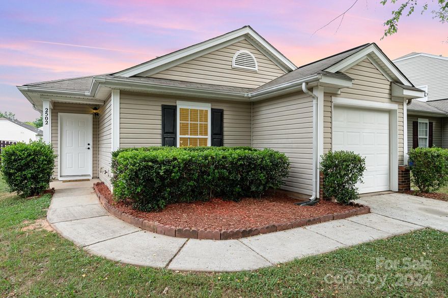 This charming one-level ranch home blends convenience + comfort, just minutes from Reedy Creek Nature Preserve with trails, sports courts, fields, + playgrounds. Enjoy quick access to the university, hospital, restaurants, banks + grocery stores, plus easy access to I-85 and I-485. The home's open floor plan creates a spacious feel in the common areas, perfect for entertaining or relaxing. The primary bedroom has its on private ensuite bathroom as well as a walk in closet. You'll appreciate the convenience of an attached 1 car garage, along w/ additional designated parking nearby for guests. This property is designed to provide both comfort and practicality, making it a wonderful place to call home. The HVAC system was replaced less than a year ago w/ larger units. Recent updates include fresh paint throughout the home + new luxury vinyl plank flooring in living room, hallway + bedrooms for low maintenance/easy cleaning. Existing fridge in the kitchen conveys.