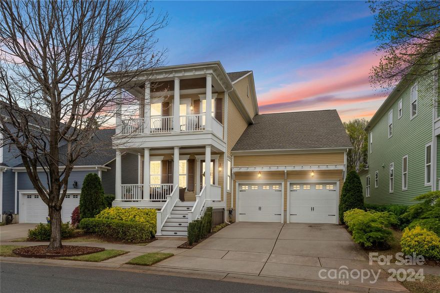 This gorgeous, Charleston-style double front porch home on the golf course in popular Springfield is located in the popular, low maintenance section of the Villas! As you enter, the home opens to an abundance of natural light, with gorgeous hardwoods!  The chef's kitchen includes a 36" WOLF range, new GE Profile appliances (2022), an expansive island, luxury cabinetry, etc.!  Smart home technology throughout, a stacked stone fireplace; adorned with built-ins, surround sound, plantation shutters, 10' ceilings throughout, etc.  The sunroom with EzeBreeze windows leads to a stone patio, all overlooking the stunning golf course!  The primary bed offers ample space w/ dual closets and a generously sized en-suite bath, featuring a soaking tub, a separate shower w/ dual shower heads, and dual vanities. The second floor hosts 3 additional bedrooms, two full baths and a loft. Springfield amenities include 6 tennis courts, pickleball, 3 pools, walking trails, playgrounds, parks, etc.   Wow!