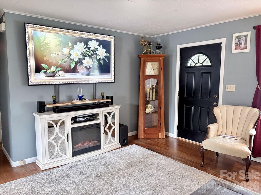 Welcome home to this inviting brick home in Nebo, located just about five miles from public access to beautiful Lake James. This home offers a warm, comfortable feel from the moment you step through the front door.

Inside, you will find three bedrooms and one full bath featuring a double vanity. The kitchen and dining area flow effortlessly together, creating a natural space for everyday living and gathering with family or friends. Wood floors add character and warmth throughout the home.

The full basement offers additional flexible space with a couple of rooms that could be used for hobbies, storage or a home office, along with washer and dryer hookup and a dedicated workshop space. Major updates include a newer heat pump and newer hot water heater, providing added comfort and efficiency.

Outside, the classic brick exterior offers timeless curb appeal, complemented by a single carport and paved driveway for convenient parking. Whether you are starting out, slowing down or simply looking for a place that feels like home, this property is ready to welcome you.