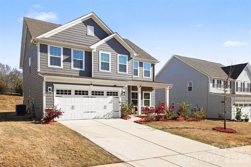 An Ansley Park dream—far from builder grade. Backing to peaceful tree-lined views, this upgraded Hudson model offers the perfect blend of space, flexibility, and thoughtful design throughout. The inviting front porch, enhanced by an upgraded elevation for added size and presence, sets the tone as you step inside to a bright, open layout ideal for both everyday living and entertaining.

The main level features brand new LVP flooring,  a private bedroom suite with a full bath, perfect for guests or multi-generational living. At the heart of the home, the kitchen shines with a large island, gas range, tile backsplash, and abundant cabinetry, seamlessly flowing into the main living areas. Just beyond, the expanded patio creates an ideal outdoor retreat to relax and unwind while enjoying the serene wooded backdrop. Warm wood accents along the staircase add character and charm.

Upstairs, the builder loft has been thoughtfully converted into a true fifth bedroom, offering even more flexibility for living, working, or hosting. The spacious primary suite features dual walk-in closets and an upgraded bath complete with a tiled shower and soaking tub.

Located in a community with resort-style amenities including a pool, playground, and walking trails, this home also offers unbeatable convenience—just minutes from Costco, Target, Lowe’s Foods, and the Indian Land YMCA.