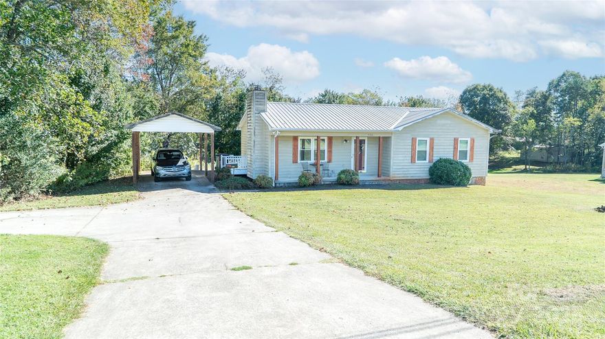 Positioned on One Acre Lot in Desirable South Caldwell Location and Offering the Advantage of a Lengthy List of NEW Updates Making This Cedar Sided, 3 BDRM/2BTH Ranch w/Full Basement One You’ll Want To See.  NEW windows and guttering, September 2025, NEW water heater in 2025, updates to bathrooms 2024 and NEW metal roof in 2016.  To add to that list is NEW, uninstalled laminate flooring for the entire house. Step inside from the covered front porch to find a natural stone fireplace that is both a beautiful and practical complement to the living room area of the seamlessly flowing, open concept plan. The bright, spacious kitchen features built to last, solid wood, custom cabinetry.  Completing the hub of the house is a roomy dining area where family and guests can gather at the table to comfortably share meals together.  Down the hall, the primary bedroom is complete with a private bath. Two additional bedrooms share the hall bath.  Convenient, main level, detached carport just a few steps from the side entry. Laundry hook ups both levels. Full basement has end garage door and offers excellent opportunity for those extra spaces you’ve needed; workshop, craft area, game room.. you decide. The huge backyard offers extensive, cleared open area perfect for establishing great outdoor living space, gardening, play area for the kids plus room for your beloved four-legged friends to roam plus wooded area for adding privacy. Rural yet close in setting with area schools, medical facilities, churches and grocery stores minutes away. 5 minutes to Hwy 321 and quick commute to I40.  Enjoy a beautiful, scenic, 40 minute drive to Blowing Rock and the High County.  Don’t hesitate to make your appointment to preview this one before it’s SOLD!