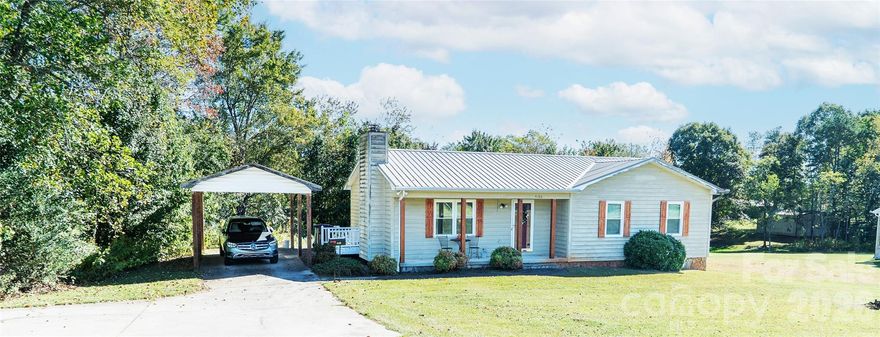 Positioned on One Acre Lot in Desirable South Caldwell Location and Offering the Advantage of a Lengthy List of NEW Updates Making This Cedar Sided, 3 BDRM/2BTH Ranch w/Full Basement One You’ll Want To See.  NEW windows and guttering, September 2025, NEW water heater in 2025, updates to bathrooms 2024 and NEW metal roof in 2016.  To add to that list is NEW, uninstalled laminate flooring for the entire house. Step inside from the covered front porch to find a natural stone fireplace that is both a beautiful and practical complement to the living room area of the seamlessly flowing, open concept plan. The bright, spacious kitchen features built to last, solid wood, custom cabinetry.  Completing the hub of the house is a roomy dining area where family and guests can gather at the table to comfortably share meals together.  Down the hall, the primary bedroom is complete with a private bath. Two additional bedrooms share the hall bath.  Convenient, main level, detached carport just a few steps from the side entry. Laundry hook ups both levels. Full basement has end garage door and offers excellent opportunity for those extra spaces you’ve needed; workshop, craft area, game room.. you decide. The huge backyard offers extensive, cleared open area perfect for establishing great outdoor living space, gardening, play area for the kids plus room for your beloved four-legged friends to roam plus wooded area for adding privacy. Rural yet close in setting with area schools, medical facilities, churches and grocery stores minutes away. 5 minutes to Hwy 321 and quick commute to I40.  Enjoy a beautiful, scenic, 40 minute drive to Blowing Rock and the High County.  Don’t hesitate to make your appointment to preview this one before it’s SOLD!