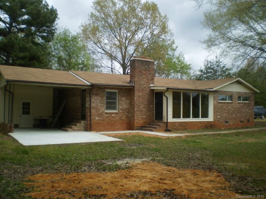 Well built home with over 6 acres and privacy.  Heated basement and carport.  Located outside city limits.