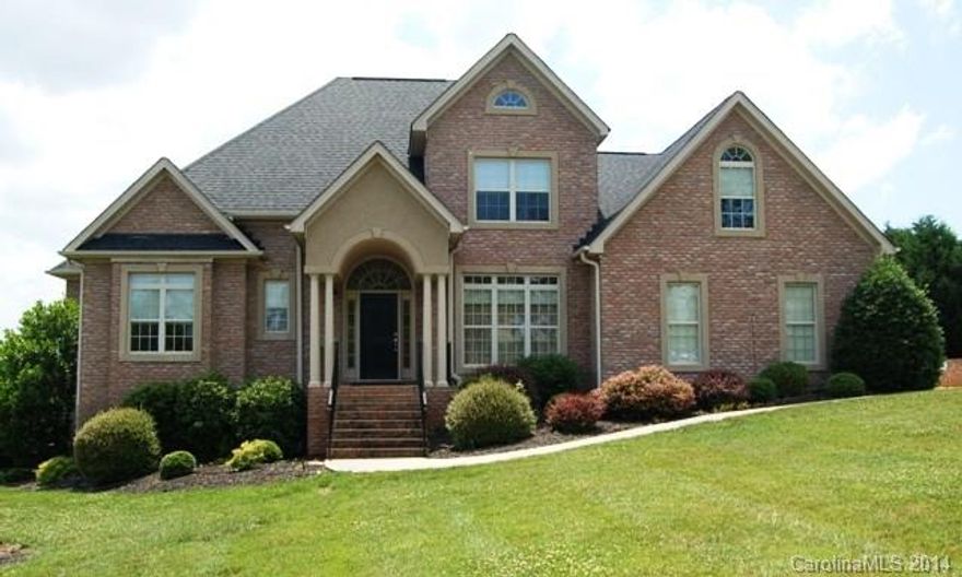 Beautiful 2 story home wiht large MBR on main level.  Large 2 story GR open to gorgeous kitchen and breakfast area, all with oak hardwood floors, granite countertop and Kenmore Elite appliances. Formal DR & foyer also have hdw floor. 2 Brs and huge Bonus room with office area upstairs. Large deck looks out upon expansive 1 acre lot. Quality living in a quality neighborhood.  Must see this one! Tons of house for the $$