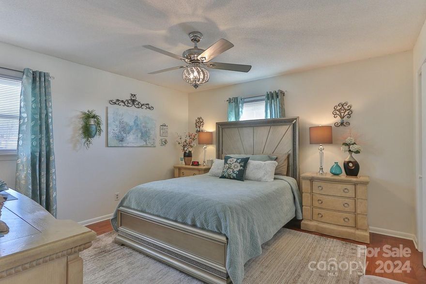 Just Reduced $15,000! Come to enjoy Gorgeous LAKE VIEW from your Living room, deck, Office and Cover screen porch! Great location. 3 Bedrooms 3 Full Baths. A LOT OF UPDATES! New Roof, HVAC 2019. New Windows, All New Exterior doors, and new driveway in 2022. Step into a recently remodeled kitchen, a culinary haven boasting marble countertops and beautiful cabinets. The spacious living room, complete with a wood-burning fireplace, sets the stage for cozy evenings. Head to the deck, soak in the hot tub, and enjoy the picturesque lake view—a true entertainer's dream! Venture downstairs to discover a partially finished basement with a den, full bath, and a flex room perfect for creative living. Beyond the aesthetics, this home embraces sustainability with energy-efficient solar panels and a water purification system for the entire house. 2-car garage, offering not just space for vehicles but also potential for a workshop or storage. Schedule a showing now before the lakeside fun slips away!