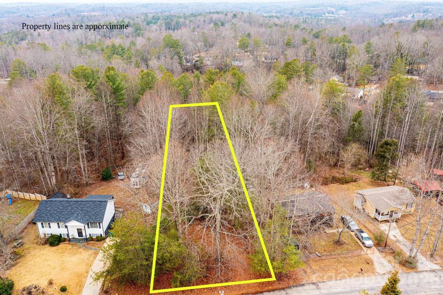 Mostly level lot located in Town and Country subdivision. Residential use. Water and sewer taps needed. There is also 11.96 acres ( per GIS)  available behind this lot .Call agent for more details.