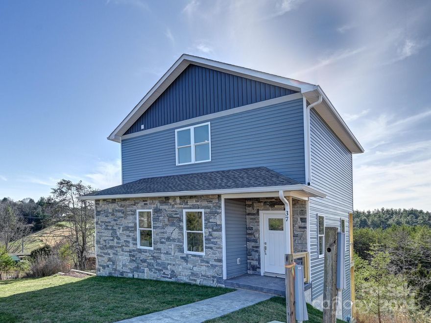 New construction minutes from Weaverville! Art's & Craft's style home offers: Luxury vinyl flooring throughout with tile in both bathrooms, granite counter tops in kitchen with stainless steel appliances and white shaker style cabinets. Primary bedroom on main with primary bath featuring a single vanity sink w/ cultured marble counter top and custom tile shower. Half bath also on main. Guest bedrooms on upper level. You will also find a office/bonus room on the upper level that offers a full bath w/ single cultured marble vanity and tub/shower combo. Home offers basement with double garage. Exterior features offer sodded yard, concrete driveway and front and back porches.