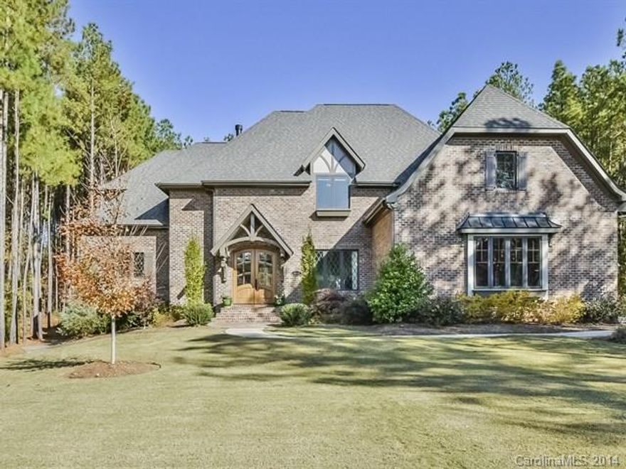 Beautiful custom home on lg wooded lot. 4br, 3/2ba, stone exterior, loaded w/ upgrades. Beautiful crown moldings, trey ceilings, exotic hardwoods. Gourmet kitchen, granite counter tops, Viking s/s appliances, island.  Formal dining, fireplaces, lg bonus, entertainment/media/rec room.  Huge screened in porch on main level, rear patio, beautifully landscaped yard, pool, outdoor kitchen, 3car garage. Minutes from Southern Bypass. A must see!