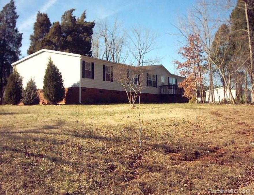 This home offers the square footage you are looking for at an affordable price! There are actually 5 bedrooms in this home but septic permit is only for 3. Large living area with fireplace. Commercial washer and dryer included! Survey and septic inspection already complete! Qualifies for FHA financing. New roof! New carpeting being installed. Trees on lot provide privacy and shade. Come look and bring offers!