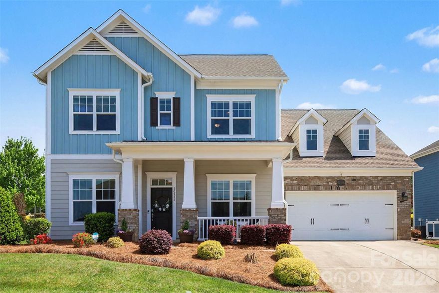 Welcome to this beautifully designed custom David Weekley home in Skybrook North, where timeless curb appeal and thoughtful living spaces come together seamlessly. A charming covered front porch sets the tone, leading into a bright, airy interior filled with natural light, elevated ceilings, and a clean, modern aesthetic.

The main level is anchored by an open-concept living area that flows effortlessly from the spacious family room with a cozy fireplace into the dining area and a stunning kitchen designed for both everyday living and entertaining. Large windows frame views of the backyard and bring in abundant light, while the layout creates a natural gathering space at the heart of the home. The primary suite on the main level offers a peaceful retreat, featuring a spacious bedroom and a beautifully appointed bath with a spa-like feel.

Also on the main level, you’ll find an additional full bedroom and bath—ideal for guests, multi-generational living, or a private home office—providing flexibility that is hard to find.

Upstairs, the second floor is thoughtfully designed to maximize both privacy and functionality. Each bedroom offers direct access to a full bath, creating a comfortable and convenient setup for family and guests alike. Two separate bonus or flex spaces provide incredible versatility for a media room, playroom, home gym, or additional lounge areas, while walk-in attic spaces offer abundant, easily accessible storage without sacrificing living space.

Outdoor living is just as inviting, with a covered rear patio that extends your living space outdoors, overlooking a well-maintained, level backyard. A built-in grill creates the perfect setting for entertaining and dining al fresco, making it easy to enjoy gatherings year-round.

Additional highlights include the peace of mind and convenience of a whole-home generator, ensuring comfort and reliability no matter the season.

Located within the desirable Skybrook community, residents enjoy convenient access to golf, pools, walking trails, and clubhouse amenities, along with nearby shopping, dining, and everyday conveniences. Commuting is easy with quick access to major roadways, while the surrounding area offers a blend ofsuburban comfort and vibrant local attractions.

With five bedrooms and four full baths across a thoughtfully designed layout, this home combines comfort, style, and functionality in one of the area’s most sought-after neighborhoods.