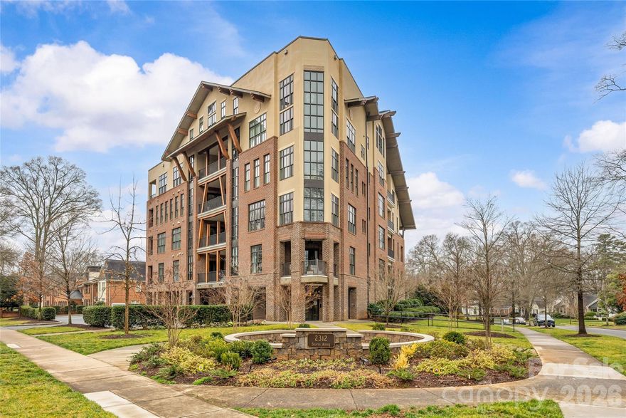 Incredible penthouse-level residence overlooking tree-lined Selwyn Avenue in Myers Park. This one-of-a-kind, 3,600+ square-foot condo built in 2018 was thoughtfully custom-designed during construction, offering a truly distinctive living experience. Soaring ceilings and expansive windows flood the home with natural light, while beautiful hardwoods and an elegant open floorplan create an ideal setting for both everyday living and effortless entertaining. The showstopping living room is anchored by a dramatic bay of floor-to-ceiling windows and a cozy  fireplace. The dining room opens to a covered terrace with see-through gas fireplace and flows seamlessly into an additional great room. The chef’s kitchen features granite countertops, custom cabinetry, center island, and top-of-the-line Thermador appliances, plus exceptional scullery with prep sink and wine fridge. Primary suite offers a private covered balcony, custom walk-in closet, and spa-like bath with heated marble floors, a zero-entry frameless glass shower, dual marble vanity, and soaking tub. Two add'l bedrooms and a full bath are located on the main level, along with laundry room, drop zone, and versatile flex space that would be perfect for an office or craft room. Upstairs, the loft leads to a 4th bedroom with en-suite bath. Add'l highlights include 2 deeded parking spaces in the gated parking garage, EV charger, personal storage unit, shared rooftop storage, and a private generator serving only this residence. This home showcases exquisite craftsmanship and exceptional attention to detail, all just minutes from neighborhood shops and dining!