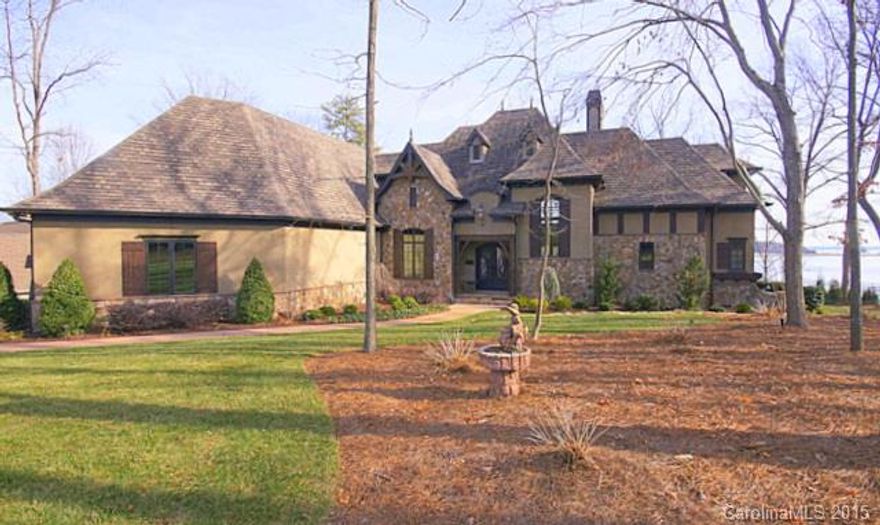 Beautiful 1.5 story custom built home on the water with Spectacular Water Views, private dock, in ground swimming pool, great location, low Iredell County Taxes & Great Schools.  3 car garage and .85 acre.  This home will not last long!