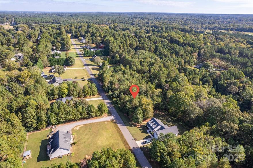 Build Your Dream Home in One of Statesville's Most Sought-After Communities! Discover the perfect canvas for your custom home on this beautiful parcel located in a well-established and scenic close knit community in Statesville, NC. Nestled among gently rolling hills and mature trees, this lot offers a peaceful setting with all the benefits of neighborhood living in a rural area. Whether you're looking to build now or invest for the future, this property offers: Spacious lots (adjacent lot also available) with plenty of room for your ideal home and outdoor living; Serene surroundings with upscale neighboring homes and community pride on a cul-de-sac street; 5 Minutes from public lake access at Long Island Marina; 8 Minutes from Lake Norman State Park; No HOA fees! Paved roads and underground utilities available; Minutes from Troutman, downtown Statesville, I-77 & I-40, shopping, dining, and schools. Don't miss this opportunity to own land in one of Statesville’s most desirable areas! Contact listing agent for more information or to schedule a showing!