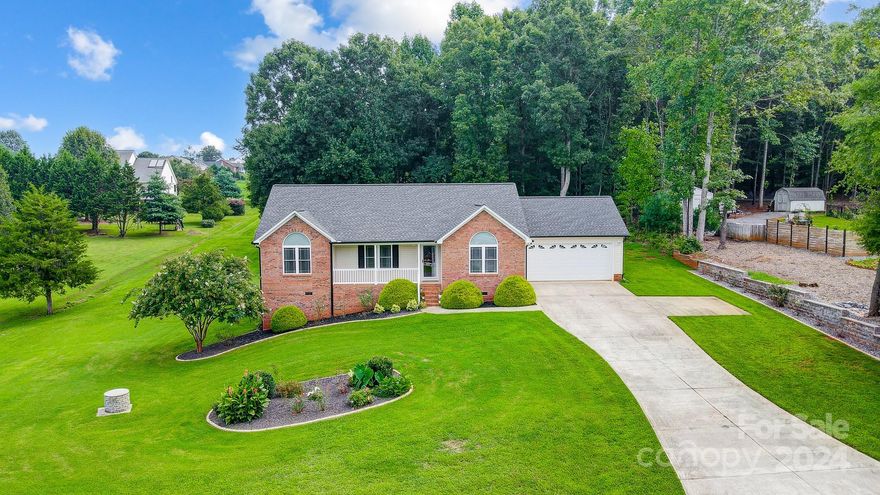 Grandview Farms. Like ‘NEW” immaculate custom-built ranch home. Move-in ready 3 bedrooms and 2 baths situated on .88 acres: open floor plan, split bedroom floor plan, vaulted ceiling, and gleaming hardwood floors. The living room features a fireplace vaulted ceiling and is open to the dining area and a kitchen with a breakfast bar. The galley kitchen features granite counters, a tile backsplash, and plenty of cabinets. The primary bedroom has a vaulted ceiling, a sitting area, and a large walk-in closet, and it offers an oversized en-suite bathroom with a jetted tub, wide walk-in shower, walk-in closet, dual sinks, and granite counters with plenty of cabinet space. Bedrooms 2 and 3 are ample and opposite the Primary with a shared hallway full bath. Just off the dining area, walk out to tranquility on the deck overlooking a large, peaceful backyard. Double extended 2-garage, NO HOA, NO City Limits.  10 minutes from downtown with local shops. Seller is offering $2,000 buyer concession.