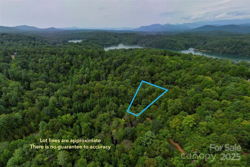 Gently sloping, wooded interior lot. Good for crawlspace or basement.  Quiet gated community with walking trails and a community pavilion at the lakeside.  Just 15 minutes to downtown Marion for shopping, restaurants and entertainment.  Enjoy hiking in the Pisgah, mountain biking at Lake James State Park & on the Fonta Flora State Trail and drives on the Blue Ridge Parkway-all within 30 minutes.  Septic and well needed.