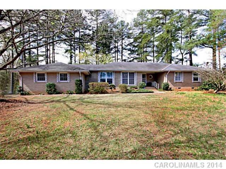 Handy Man Special!! Full brick ranch home with 2 car garage on over 2 acres in desirable Huntersville location with Cabarrus county taxes! 1.25 acres of the 2.12 can be divided up to 2 lots and resold as a buildable lots or build a couple homes! Home features large great room, living room with wood burning fireplace, dining room and good size kitchen! Relax on the deck overlooking flat yard and trees! Storage building and 1 year home warranty included! Plus, no HOA!