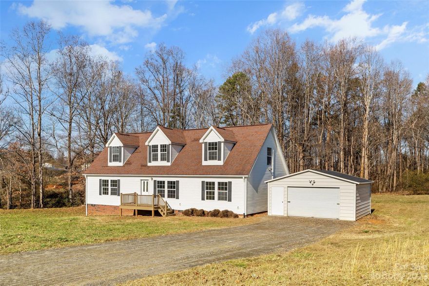 This cute 1.5-story modular home on over an acre of land with a detached garage is move-in ready! Cul-de-sac lot on a low-traffic street. Large front lawn and a private wooded backyard. Open floor plan in the living room, kitchen, and dining area. The spacious main-level primary suite has a large bath with a garden tub, a separate shower, and a dual-sink vanity. You'll find 2 more bedrooms on the other side of this split-bedroom plan, both with walk-in closets and a full bath to share. The upper level has been finished to include a huge bonus room and an office/flex space, each room with a closet and served by its own brand-new mini-split HVAC system for customized temperature control. A new HVAC system serves the lower-level rooms. Rural neighborhood, yet with no HOA dues and conveniently located just a short drive from I-40!