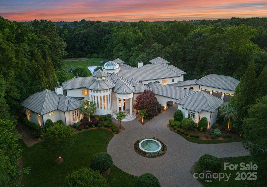 "LIVE LIKE A CHAMPION" in this truly One Of One Legacy Estate where luxury, privacy and prestige meet. This 12,000 SF estate on 30-acres offers unrivaled privacy, luxury, and scale. Owned by NBA legend and all-star, this home features soaring 30-ft ceiling in the living room, elevator, exquisite architectural details and grand living spaces. Designed for both entertaining and relaxation, amenities include a regulation lighted basketball court, professional gym with sauna and steam room, home theater, full bar with billiards and 8-car garage. The chef’s kitchen flows into elegant living areas, while the expansive primary suite offers a spa-like retreat. Outdoors, enjoy rolling lawns, private pond, pool and hot tub with cabana, wooded seclusion and multiple outdoor gathering spaces. A gated drive ensures total privacy. Built by and for someone who lives life at the highest level, this estate is a legacy property—rare, refined, and unforgettable.  Don't miss your opportunity to live like a champion!