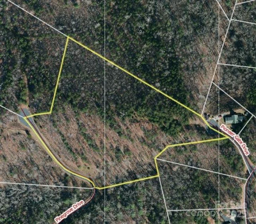 Nestled in the desirable gated community of South Mountain Peaks, this stunning 7.44-acre tract offers breathtaking long-range mountain views and multiple prime building sites. Enjoy privacy, nature, and the serenity of mountain living with easy paved road access. A partially roughed-in gravel driveway is already in place, making it easier to envision your dream home. Located just a short drive from Asheville, Hendersonville, Marion, Black Mountain, and the Blue Ridge Parkway, as well as shopping, dining, and outdoor recreation. Don’t miss this rare opportunity! Call to set up your private showing today. Offered below county tax value. Motivated Seller.