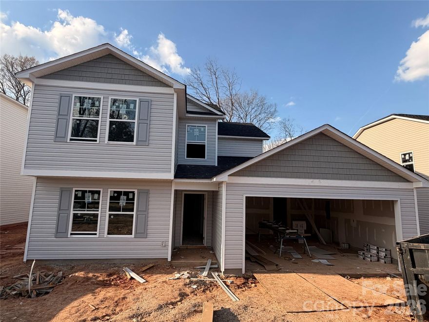 Nestled among many updated homes from yesteryear, this one of five new construction homes offers a modern living experience. The five-bedroom home features a guest bedroom and a full bath on the main floor. The new construction boasts flush mount LED lighting, luxury vinyl plank flooring, and a spacious two-car garage. Covered front and rear porches provide additional outdoor living space. The kitchen is a chef’s delight, equipped with soft-close cabinets, stainless steel appliances, a walk-in pantry, and a kitchen island. The transitional floor plan includes a primary suite upstairs, followed by three more bedrooms. Located in Downtown Lancaster, just a few blocks from restaurants, shops, and businesses, this home is conveniently situated near Lancaster’s active arts council, which hosts regular concerts and an award-winning playhouse. Additionally, the area is home to MUSC Lancaster Campus, a learning hospital, a movie theater, and much more. Don’t miss out on this opportunity to see this new home today. Schedule an appointment to visit.