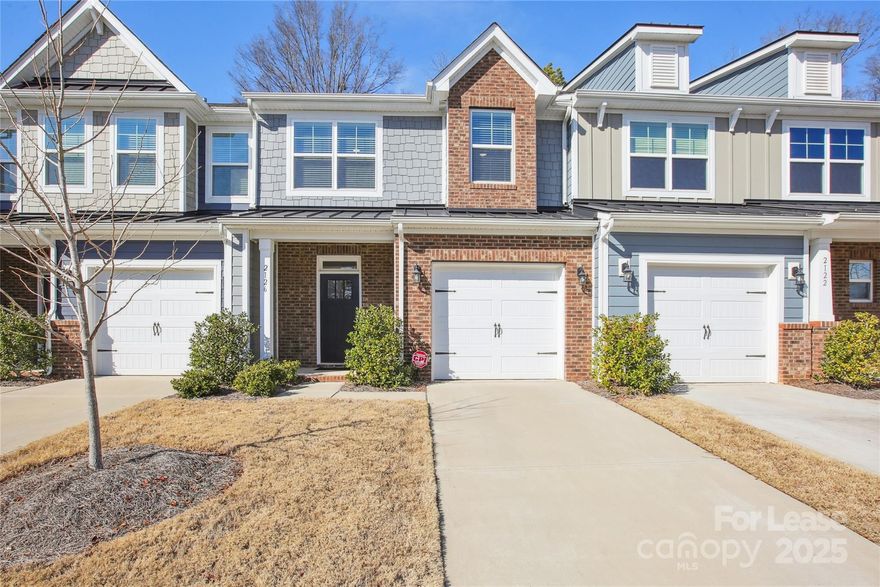 This townhome has three bedrooms, 2.5 baths, and more than 1,900 square feet. The primary bath also features a double-bowl vanity and a tiled, walk-in shower with a semi-frameless door. The kitchen features white cabinets with crown molding, granite counters, a white subway tile backsplash, and stainless appliances, including a gas range. Beautiful and durable Enhanced Vinyl Plank flooring covers the main and all bathrooms feature quartz counters.