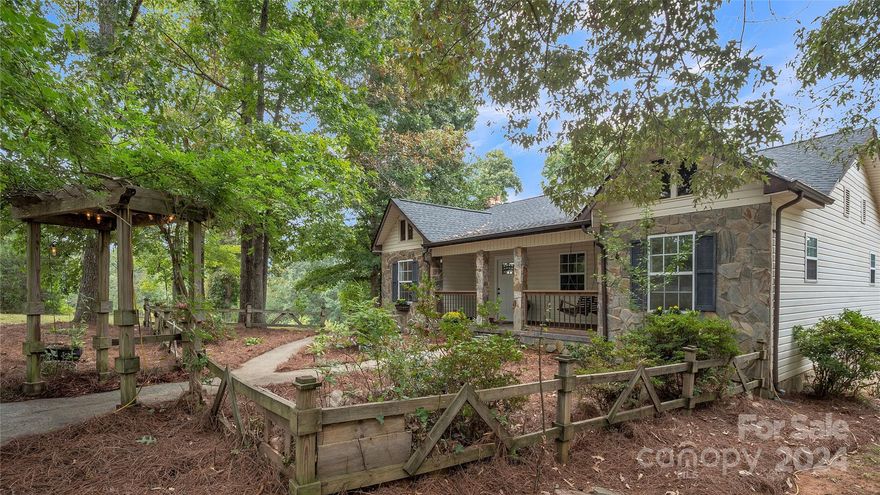 Discover the allure of this beautifully renovated French country home, nestled on 5.45 picturesque acres. This stunning property features 4 bedrooms, 3.5 baths and a fully finished basement complete with a second kitchen—ideal for entertaining or extended living. The serene, mostly cleared landscape is a nature lover’s dream, with flourishing Muscadine, white and red grapevines, as well as a variety of fruit trees including apple, pear, peach, plum and fig. Whether you're enjoying the beauty of your private orchard, hosting gatherings, or simply unwinding in your tranquil surroundings, this home offers the perfect blend of elegance, comfort, and rural charm. A truly unique and inviting retreat!