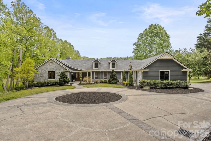 Experience extraordinary luxury living in prestigious Kenmure- a gated golf course community in this absolutely stunning, fully renovated masterpiece overlooking the 18th fairway. Perfectly positioned on a premier 0.87 acre mostly level lot with a stream bordering the property, this exceptional open concept 3 bedroom, 3.5 bath home offers the utmost privacy, breathtaking golf course views and exquisite designer finishes throughout. No detail was overlooked in this complete transformation creating a like-new luxury residence of unparalleled quality and sophistication. Prepare to be impressed from the moment you arrive via the stately circular driveway and elegant entrance. The expansive main level features over 3,000 square feet of refined luxury living with all new hardwood and designer tile flooring, all new windows and doors, stunning designer lighting fixtures and exceptional architectural detailing throughout. The inviting great room showcases a soaring cathedral tongue-and-groove ceiling with beam, expansive windows framing the picturesque setting and a spectacular gas fireplace with old-world brick surround flanked by custom cabinetry. A stylish bar area with wine cooler, granite countertop and glass display cabinetry creates the perfect setting for entertaining. The elegant dining area flows seamlessly into the spectacular designer kitchen featuring gorgeous shaker cabinetry, unique hardware, stunning granite countertops, designer tile backsplash, oversized farmhouse sink, walk-in pantry, built-in recipe bookshelves and high-end Thermador appliances including an oversized gas range with custom curved artisan wood hood, built-in microwave with sensor cooking, 36 inch refrigerator/freezer and dishwasher, abundant cabinetry and drawer space. The spacious breakfast area completes this incredible gathering space designed for both entertaining and everyday living. The luxurious primary suite is a true retreat featuring access to the private deck, custom walk-in closet with built-ins and an extraordinary spa-inspired bath with dual granite vanities, freestanding soaking tub, oversized tiled shower with bench and glass enclosure and separate water closet. Additional main level highlights include a spacious study or guest bedroom with deck access, a beautifully appointed guest suite with exquisite bath boasting designer tile floors, double vanity and walk-in tiled shower, elegant powder room, huge walk-in coat closet, and oversized laundry room with washer and dryer, sink, cabinetry with plenty counter space and built-in ironing board. The stairway leading to the lower level is absolutely stunning with exquisite detailing on walls and gorgeous designer tile on the landing that lead to the beautifully finished lower level offering an ideal guest or in-law suite complete with a full-size kitchen featuring stainless appliances and granite countertops, expansive family and recreation rooms, large bedroom, full bath with granite vanity and tub/shower combo, bonus/craft room, flex space, and tremendous storage areas. Outdoor living is equally exceptional with expansive decking and patio areas overlooking the pristine green space, stream, and spectacular 18th fairway setting. Additional highlights include two brand new HVAC systems, new water heater and a prime location just a short stroll to the clubhouse and outstanding amenities of Kenmure. This is an extremely rare opportunity to own a completely renovated luxury home on one of the most desirable lots in the community. Exceptional craftsmanship, exquisite taste and timeless elegance define this magnificent residence.