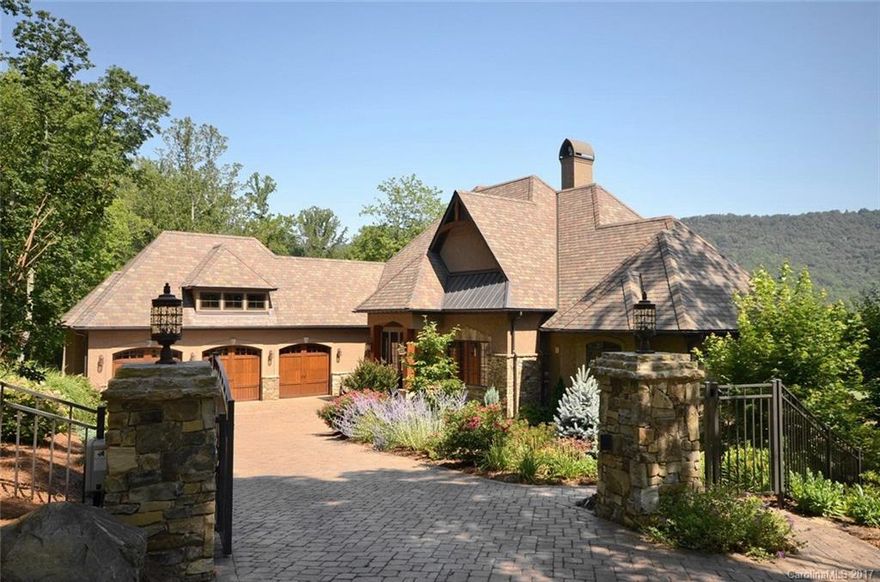 Rare opportunity to own 3 acres with view of the Walnut Cove golf course, Blue Ridge Parkway and Pisgah National Forest. Home sits 300-ft away from golf course providing access and privacy. Expertly finished, open floor plan welcomes views into nearly every room. Spacious outdoor living includes screened porch with fireplace, terrace, waterfall, fire pit. Exquisitely landscaped exteriors w/secure electronic gate to motor court. Interior rooms large and well-appointed featuring a gourmet kitchen.