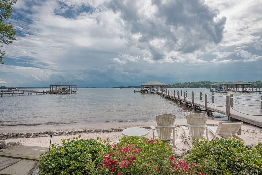 WATERFRONT ON LAKE NORMAN! FOREVER VIEWS OF MAIN CHANNEL! LOCATED OFF HIGHLY DESIRABLE ISLE OF PINES PENINSULA.  4BR w/Addl flex space used as Large 5th Bedroom.  5 Full Bathrooms including one off deck for outside access for the lake days.  Fenced in area for dog run. Beach Area leading to Dock with Boat Slip, 2 Boat Lifts AND Jet Ski Lift. Level Yard in front and back, Lot can't be beat and Views are PRICELESS!  Immaculately Maintained, Renovated Main Level & Kitchen w/Upgraded SS Appliances.