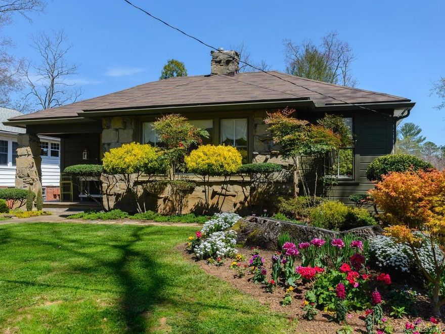 This immaculately landscaped Arts & Crafts Cottage in desirable West Asheville is a must see!  The home features Stainless Refrigerator, wood floors, restored windows, new paint inside and out, custom built-ins, and a large private back yard that is perfect for entertaining guests.  The yard contains mature trees, custom rock walls, a detached outbuilding, and a covered patio for outdoor living.  The home is  also a couple blocks walk to Malvern hills park/pool.