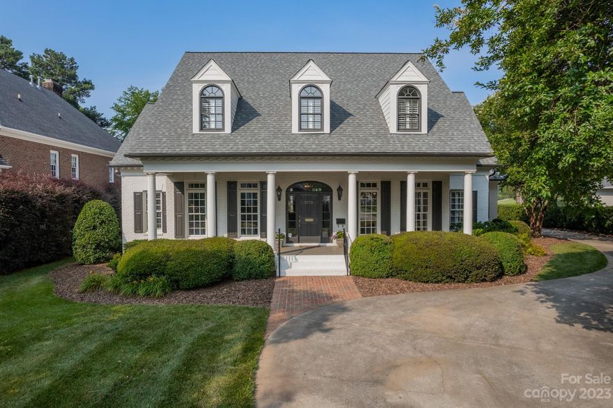 Beautiful home on large .7 acre lot, situated on the 6th fairway of Myers Park CC. High ceilings, gorgeous hardwood floors and crown molding. Primary suite on the main level and 3 bedrooms on the second floor, plus a large bonus room and separate office or workout space. Kitchen and breakfast area open to the family room. Covered patio and brick terrace with fireplace are perfect for outdoor entertaining. Huge flat backyard would be ideal for a future pool. Plenty of parking with 2 car attached garage and circular driveway. Irrigation, landscape lighting, storage racks and heater in garage, security system installed. Whole-house generator, most HVAC and roof are new within the last 3-5 years. Conveniently located near SouthPark and downtown Charlotte.