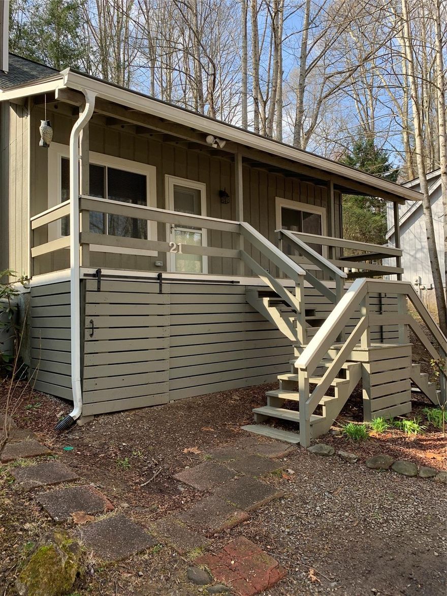 Seller motivated! REDUCED to $299,900. NEW interior paint and lots of upgrades done in the last two weeks. The home is now move in ready. Can close quickly if needed.

2 story home in the heart of Maggie Valley. Upstairs loft over looks living room with large stone fireplace (new insert). Small rushing creek located on side of home with a rocking porch overlooking small creek. Wooded mountain home with year round access just off Soco Rd. Newer stainless steel appliances. Master bedroom on first floor and 2nd bedroom with bonus room w/ closet on second floor. Full bathrooms on both floors. Large rocking porch on front of home. NEW mini splits on both floors. NEW main sewer line recently installed. Located in the hottest air bnb area in the valley!