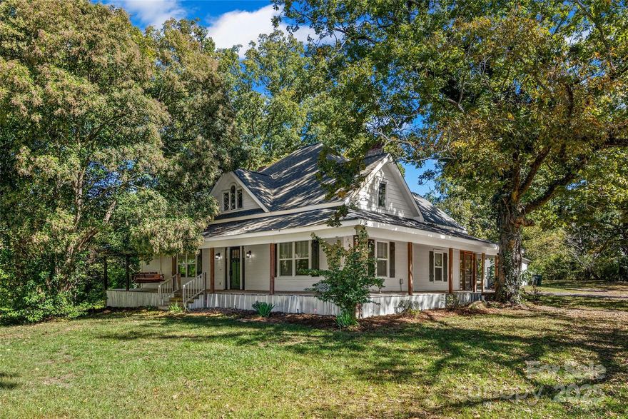 Step back in time while enjoying the comforts of a fully modernized home on this 4.57 Acre homestead. Charm and character come to life in this circa 1930 farmhouse, which underwent a meticulous & thoughtful restoration in 2018. The entire home was taken down to the studs & completely rebuilt with new plumbing, new electrical & new HVAC, ensuring a modern, worry-free infrastructure. The soul of the home was maintained by repurposing original wainscoting, shiplap, some of the hardwood floors & the 1903 clawfoot tub, now set beautifully in a unique hall bath water room. The updated design features an open-concept living area, a dedicated office & a gorgeous kitchen with a propane gas cooktop, double oven & disguised walk-in pantry. Lifestyle living is at its best outdoors with an amazing wrap-around front porch ready for your rocking chairs & an equally inviting screened porch out back that overlooks the landscape & circa 1890 tack barn. The property is an outdoor enthusiast's dream, featuring two separate fenced areas, numerous fruit-bearing plants (pecan, blueberry, fig, muscadine, etc.), a large workshop & the renovated 'Chick-Coop' outbuilding, perfect as a crafter's dream space or work-from-home retreat. Complete with a new well pump (2025), a water softener, Renni tankless water heater & Spectrum/Comporium fiber internet, this home truly blends rustic heritage with all the modern amenities you could desire.