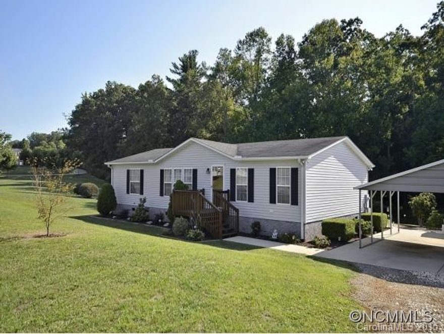 IMMACULATE! Well maintained home sited on 1.12 acres. Easy one-level living offers 3BR/2BA, open floorplan, master with walk-in closet and large soaking tub and step-in shower. Large deck to enjoy the privacy and pretty landscaping. 2-car detached carport and utility building. Room for gardens and or expansion. Built to modular specifications. You will not be disappointed.