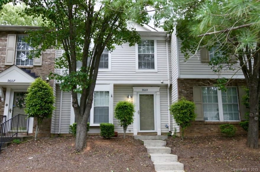 Back on market! 2 LARGE BR's, fresh painted and move in ready w/new carpet in LR, MBR, stairs & hall. Hardwood floors in kitchen and dining area.  Lovely large enclosed patio with treed area behind the home, storage closet too!  Both spacious bedrooms upstairs with lots of closet space, large bath.  Half bath downstairs, pass through kitchen; laundry closet off of kitchen.  New HVAC and air handler in 2013; New water heater in 2012.  Community pool.  You don't want to miss this one!