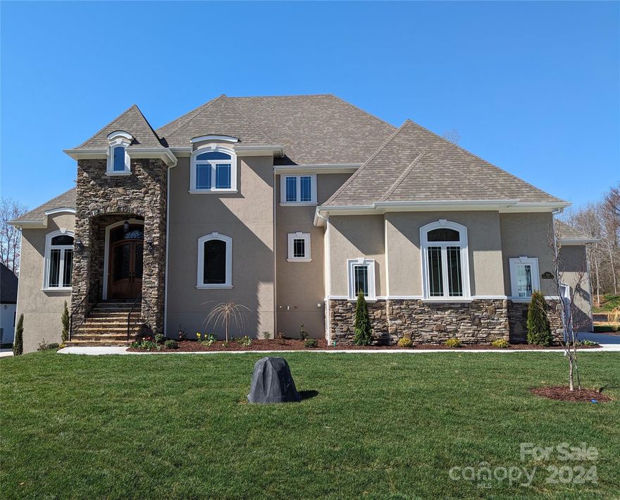 Stunning Sanctuary with plenty of room to roam inside and out! Every detail has been well thought out in this open floor plan! Gorgeous Fireplace in Great room, private office for working at home, Sizable Dining room for entertaining. Huge kitchen with spacious island, custom cabinets, High end Thermador appliances plus breakfast room.  Bonus room with access to bath and WIC provides extra flexibility Secluded main level primary suite with ensuite Attention to detail thruout makes this home next level -detailed trim and ceilings & bullnose corners Oversized screened in outdoor living area for playing/relaxing Walk out basement with roughed in plumbing provides even more adaptable space and opens to an addl outdoor entertaining area Stucco & stone exterior 3 garages (2+1) Room for pool. Large backyard. Spacious lot on cul de sac road. Ideal location close to lake, marinas, shopping, restaurants, medical, schools and commuting. Come today to make to make this beautiful  home your own!