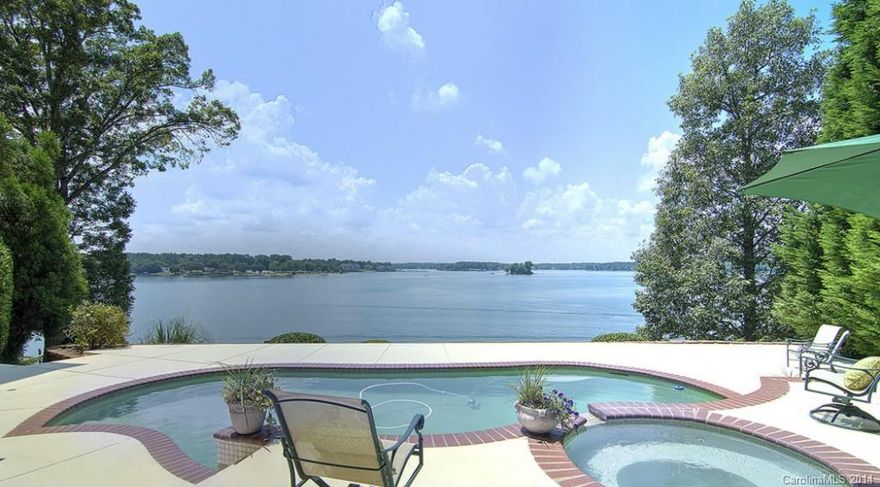 Breathtaking panoramic main channel views from almost every room!  Truly unique custom home w/wall to wall windows, resort-style multi-level decks, beautiful newly tiled custom pool w/spa, covered gazebo over water, boat lift.  Home is accented with exposed knotted pine ceilings and unique architectural lines, just renovated kitchen, gorgeous Master Retreat with stone fireplace, updated Master Bath.  Lower level has rec room and three addnl bedrooms.  Vacation lifestyle, FM Schools! HURRY HOME!