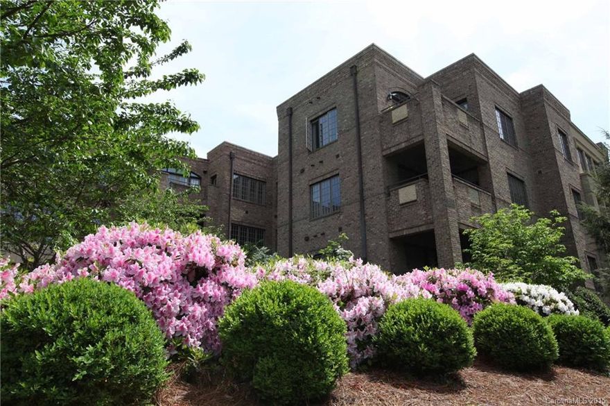 A must see! Large porch overlooks the beauty of Myers Park and Queens Road! Two reserved spaces in mid-rise's parking deck, secured building with elevator. Lovely courtyard and beautifully landscaped grounds. 2 BR PLUS office or 3 BR, one without closet. Hardwoods throughout, large living area and fireplace.  Granite kitchen with gas cook top, stainless appliances, beautiful master bath with jetted tub! The pictures truly don't do this home justice.