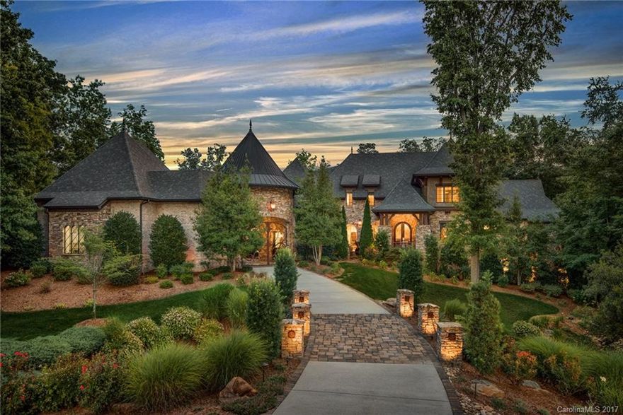 Stunning French Eclectic Estate in Gated Chatelaine Community. Exquisite attention to detail in this meticulously maintained home. Nestled in mature landscaped setting, the home boasts countless upgrades.  From stunning entry way to multi-level grand staircase. Spacious 2-story great room. Over-garage art/music rm is plumbed. Will convert to bed/bathroom. Lower Level with family room w fplace, billiards, theater, bar, exercise room. Priv outdoor living w pool, fplace.