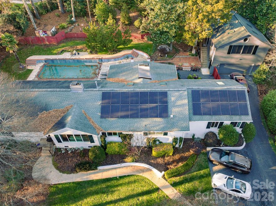 Private 1/2-acre oasis in the heart of south Charlotte at end of quiet street off Providence Road at Fairview.  Renovate, new construction build, or move in to the well maintained, white painted brick ranch 4 bedroom/3 full bath with formal and casual living rooms, spacious sunroom, large renovated kitchen and 2 car garage with modern full kitchen/bathroom apartment above (see pictures).  All on one level living except detached full kitchen apartment is above garage with private entrance and can be used as a studio, mancave, guest house, short term daily rental, or long term rental income as there is no HOA or rental restrictions above city code.  Full laundry hook ups off primary bedroom and in garage for apartment.  
Park in the oversized 2 car garage or dedicated spots near front door.  As you enter the foyer a formal living room is to the right and informal family room straight ahead.  All 4 main home bedrooms have closets though 2 are currently used as offices.  The 3 seasons sunroom connected to the informal den sits right beside the inground chlorine pool with large hardscaped deck surround.  The mature shade trees and professional landscape cover the entire lot with decades of carefully chosen Japanese maples and various specialty plants added over the years.  No traffic to be heard or seen on this dead end with tremendous upside whichever route you determine to be highest and best use of property.   Solar power system (2 Tesla storage batteries and 27 panels for full house power during an outage. 
A beautiful home with endless possibilities sure to be a great investment.  Location, location, homecation!