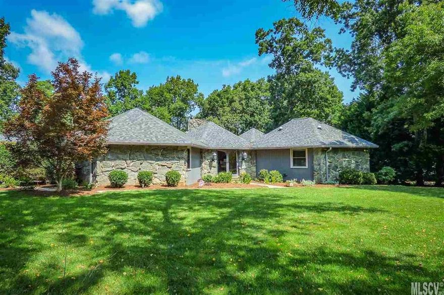 This expansive one-level home in Catawba Springs offers a unique, geometric design with relaxing, park-like setting with in-ground pool! Situated on the #6 Green of the Dogwood Course, this custom home is surrounded by over half an acre of level yard with lush green grass and beautiful landscaping! The welcoming front entrance leads you into a large living room with stone fireplace and exit to the rear deck. From there, you'll find a relaxing family room with adjoining dining area and kitchen with garden window, wall oven, and cooktop. The split floor plan offers a private master suite with exit to deck and large bathroom with charming Spanish tile accents, garden tub, double vanity, and separate shower. The flexible floor plan also features four additional bedrooms that can double as a home office, den, or workout space. Relax on the rear deck overlooking the golf course or around the sparkling in-ground pool. Double detached garage with breezeway to house. HOA Dues $75/year.