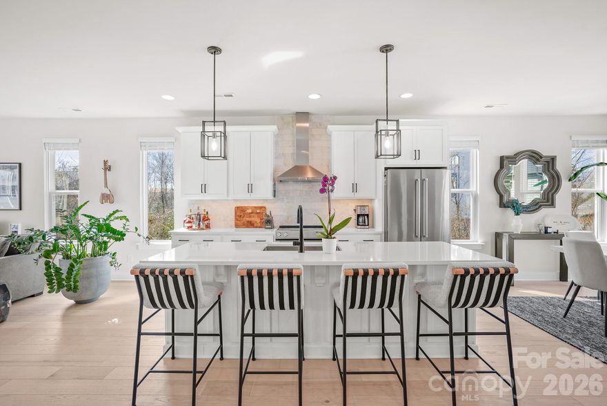 This exceptional end-unit townhome offers four bedrooms, four and a half baths, and a two-car garage—delivering expansive, versatile living across four thoughtfully designed levels. The top floor features a spacious fourth bedroom or optional bonus room, complete with a full bath and private rooftop terrace—perfect for entertaining or unwinding while taking in skyline views.
Refined finishes elevate every level, including six-inch plank hardwood floors throughout, custom built-in wood closets in the primary suite and secondary upstairs bedroom, and a beautifully designed custom laundry room. The chef’s kitchen showcases white shaker-style cabinetry, quartz countertops, and premium KitchenAid appliances, blending timeless style with modern functionality.
Enjoy unbeatable walkability just steps from The Olde Mecklenburg Brewery, Queen Park Social, Protagonist Beer, South End Brewery, and Sugar Creek Brewing Company—with effortless access to shopping, dining, entertainment, and the Light Rail.