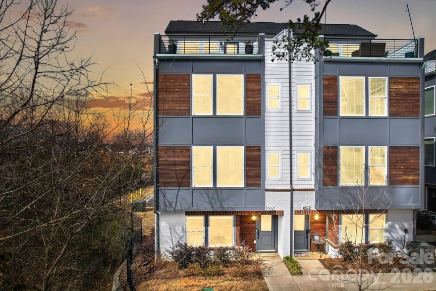 This exceptional end-unit townhome offers four bedrooms, four and a half baths, and a two-car garage—delivering expansive, versatile living across four thoughtfully designed levels. The top floor features a spacious fourth bedroom or optional bonus room, complete with a full bath and private rooftop terrace—perfect for entertaining or unwinding while taking in skyline views.
Refined finishes elevate every level, including six-inch plank hardwood floors throughout, custom built-in wood closets in the primary suite and secondary upstairs bedroom, and a beautifully designed custom laundry room. The chef’s kitchen showcases white shaker-style cabinetry, quartz countertops, and premium KitchenAid appliances, blending timeless style with modern functionality.
Enjoy unbeatable walkability just steps from The Olde Mecklenburg Brewery, Queen Park Social, Protagonist Beer, South End Brewery, and Sugar Creek Brewing Company—with effortless access to shopping, dining, entertainment, and the Light Rail.