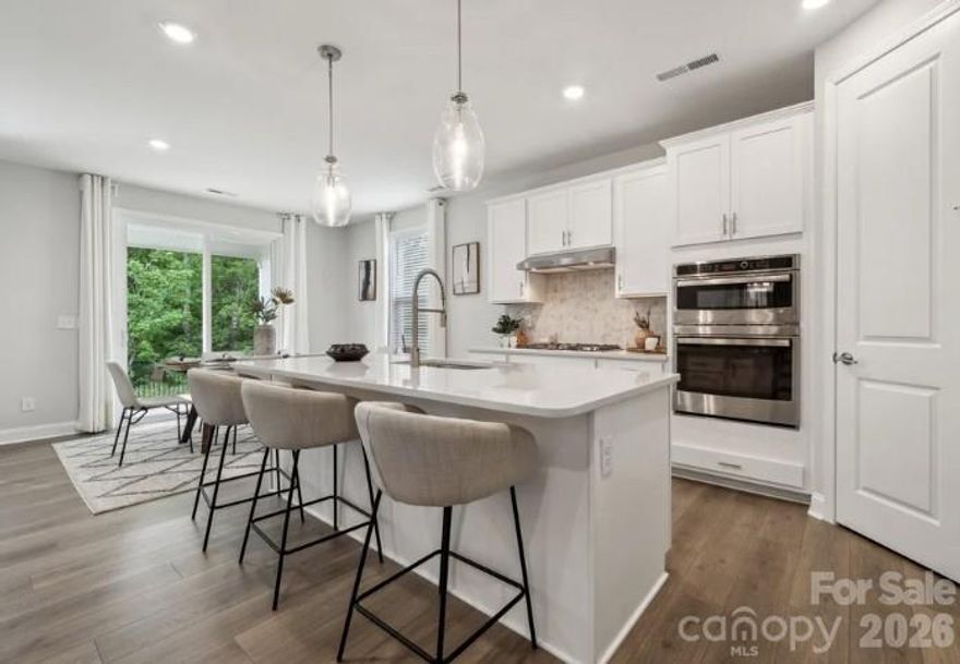 What's Special: Wooded View | No Rear Neighbors | Dedicated Study | Covered Patio | 1st Floor Guest Bedroom.  New Construction – August Completion! Built by America's Most Trusted Homebuilder. Welcome to the Elizabeth at 203 Goorawing Lane in Stafford at Langtree! The Elizabeth is a beautiful new floor plan that feels open and welcoming from the moment you step inside. The great room flows gently into a spacious kitchen, casual dining area, and outdoor living space, creating a bright setting for everyday moments. A roomy pantry, first floor bedroom with nearby bathroom, and a private study add comfort and flexibility. Upstairs, the primary retreat stretches across the back of the home, offering a peaceful space to unwind with a soaking tub, separate shower, dual sinks, private commode, and generous walk-in closet. The second level also includes two additional bedrooms, a shared full bath, a laundry room, a cozy tech space, and a spacious loft. Discover Stafford at Langtree in Mooresville, NC, where every day feels like a getaway. Enjoy the pool and cabanas, plus access to I-77, Lake Norman, Downtown Mooresville and Davidson. Swim, boat, fish, jet ski or kayak on Lake Norman or hike the trails in Lake Norman State Park. Mooresville is one of the fastest-growing suburbs in the U.S., and your community is buzzing with excitement and opportunity! Additional Highlights Include: Gourmet kitchen, gas fireplace at great room, soaking tub at primary bath, covered outdoor living, and study in place of flex. Photos are for representative purposes only. MLS#4351543