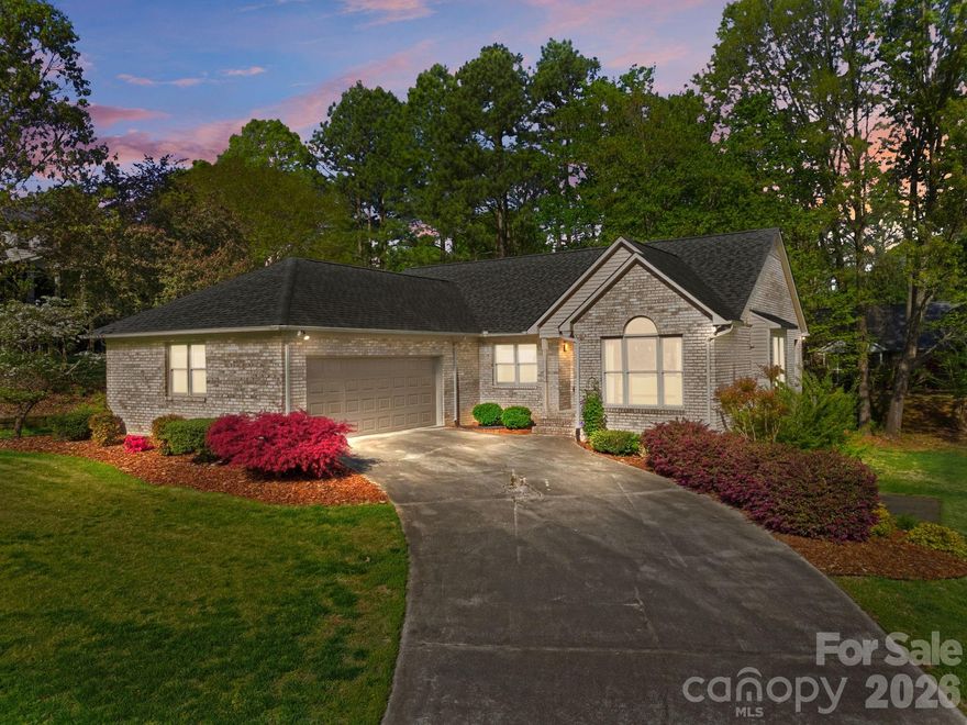 Welcome to 406 Vincent Court, nestled in the desirable Corbin Hills community of Salisbury, NC where classic brick craftsmanship meets vibrant, modern living. This spectacular 4-bedroom, 3-bathroom home offers an impressive 3,668 total square feet across two beautifully finished levels, all situated on a gorgeous half-acre lot just a short walk from the golf course. From the moment you step inside, you'll be captivated by the home's bright, multicolored aesthetic and the abundance of natural light that pours through every room. The main level boasts 1,850 sq. ft. of open-concept living, featuring a fully remodeled kitchen that flows effortlessly into the living and dining areas, perfect for entertaining. Step outside through the covered patio just off the kitchen and living area for seamless indoor-outdoor enjoyment. The primary bedroom suite is conveniently located on the main level and features not one, but two walk-in closets, a true luxury. The laundry room is also on the main level, keeping daily living easy and efficient. Downstairs, the fully finished walkout basement adds another 1,818 sq. ft. of incredible flexibility. Complete with a second kitchen, two bedrooms, and a full bath, this space is ideal as a second living area or in law suite, the possibilities are endless. With its unbeatable combination of space, charm, updates, and location, this is a rare find in Corbin Hills. Schedule your private tour today!