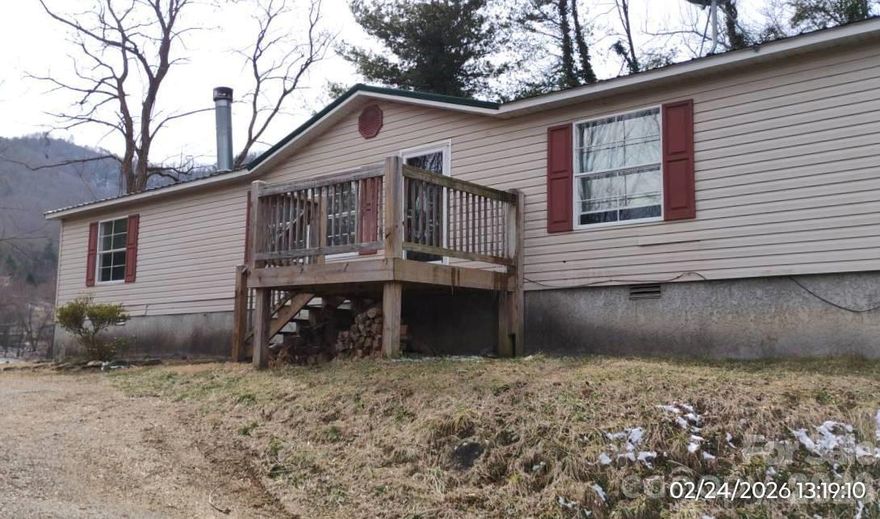 Get away to the mountains and find this peaceful retreat in the Cruso area of Canton. This home offers easy, low maintenance living, with both a front and back deck for relaxing or entertaining. The open floor plan allows versatility and great flow throughout the home. If you are looking for affordable one level living, then take a look at this freshly painted retreat with rock accented Living room fireplace and serene views.