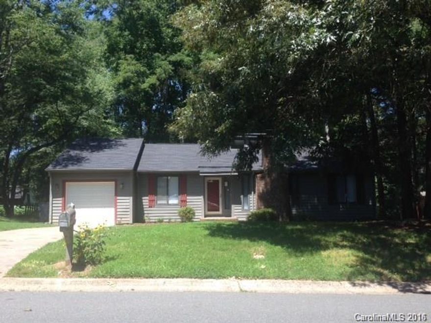 3 bedroom 2 full bath house with a 1 car garage and sunroom overlooking a wooded backyard. Beautiful new ultra wide plank flooring resembling the texture and color of hardwoods. Freshly painted. Updated cabinets in the kitchen.