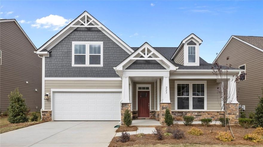 Our fabulous Cooper 3 plan is a one and a half story with a finished bonus room above garage.  This is our WOW plan w/ a fantastic kitchen featuring an oversized island, w/ white Farmhouse sink, white cabinets & Quartz counter top, Wall Oven & Microwave, 5-Burner Gas Cooktop, Range Hood, SS Appliances & Tile Backsplash.  The large family room has a vaulted ceiling w/ a gas log fireplace!  The primary bedroom features a walk-in closet along w/ its en-suite primary bath.  The bath has dual raised vanity, tile floor, semi-frameless shower with seat & tile surround, linen closet & water closet. Generously sized bonus room, a 4th bedroom, full bath & walk-in Storage!  Rear Covered patio!  Paddlers Cove offers an abundance of amenities, both natural & traditional: 2 Pools, open air pavilion, play ground, County Park/Lake Wylie Sports Complex is right in the center of the community.